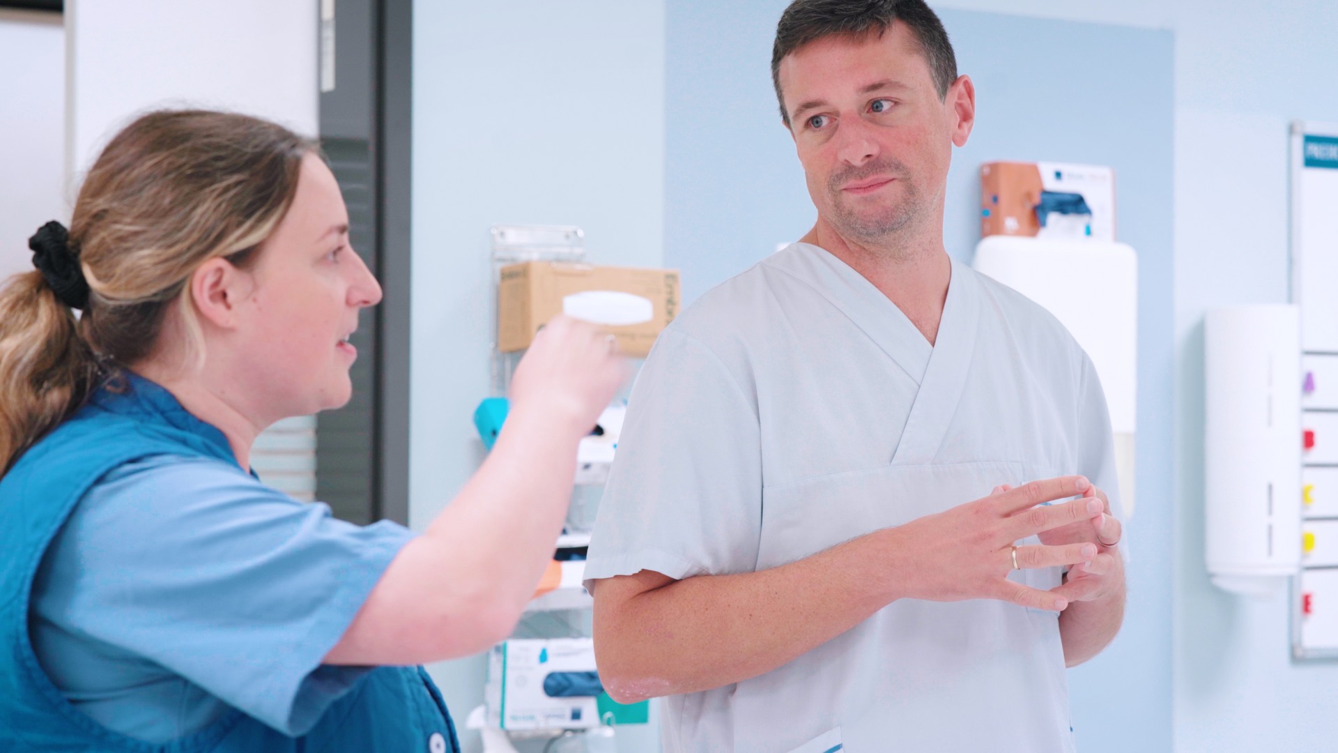 A man and a woman in a hospital room.