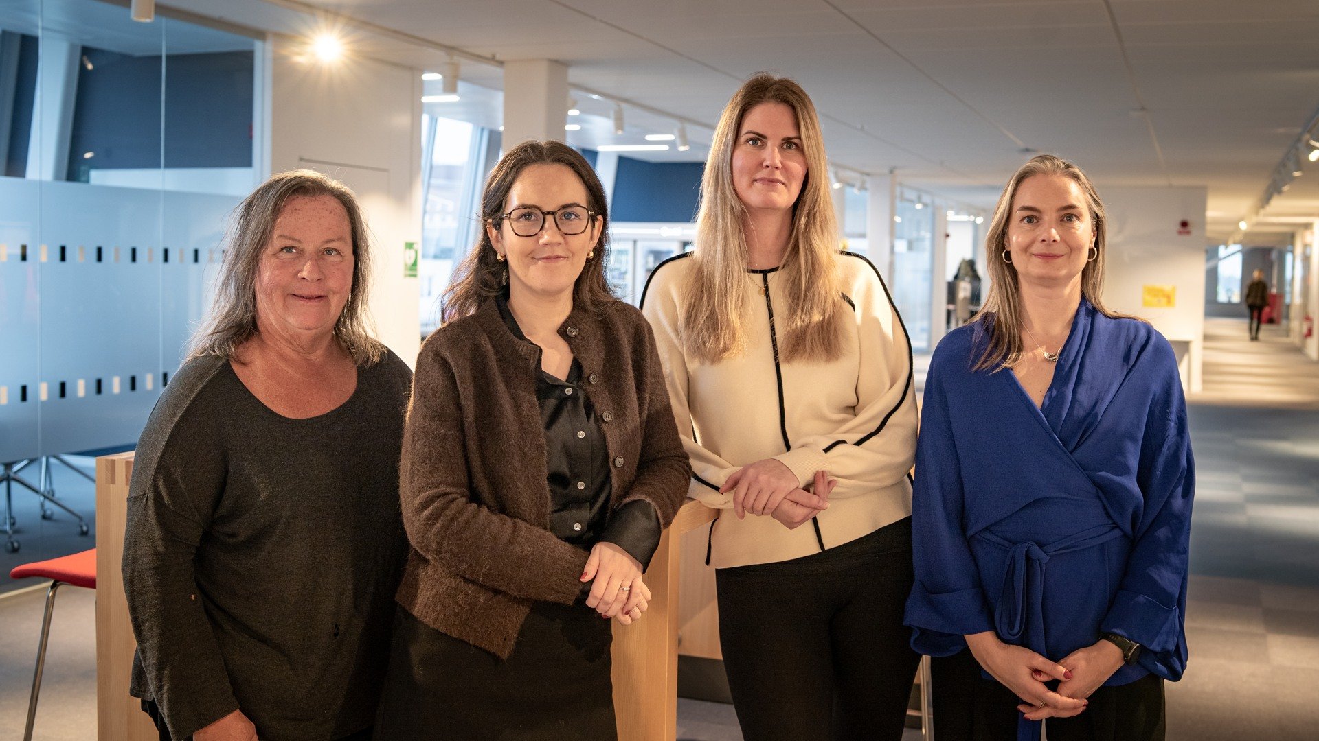 A group of women standing next to each other.