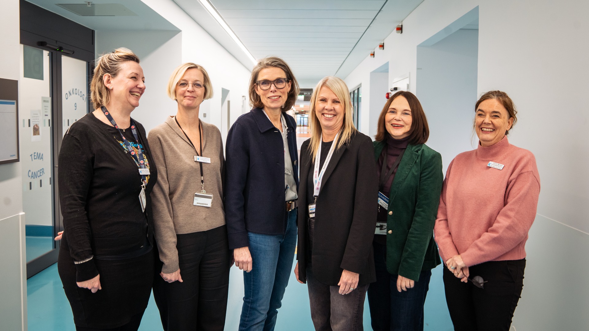 A group of women standing next to each other.