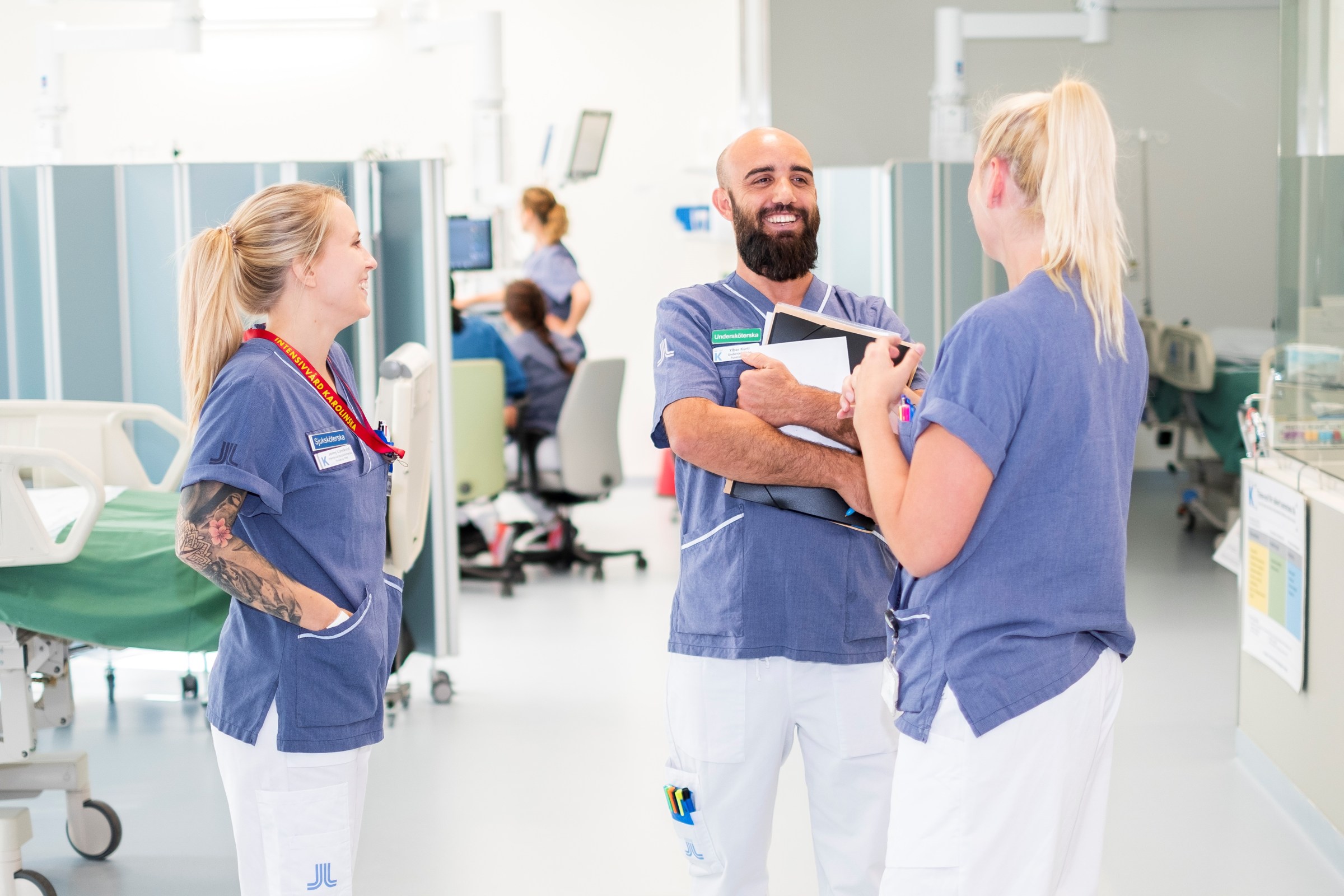 three nursing staff talking in hospital environment at Karolinska