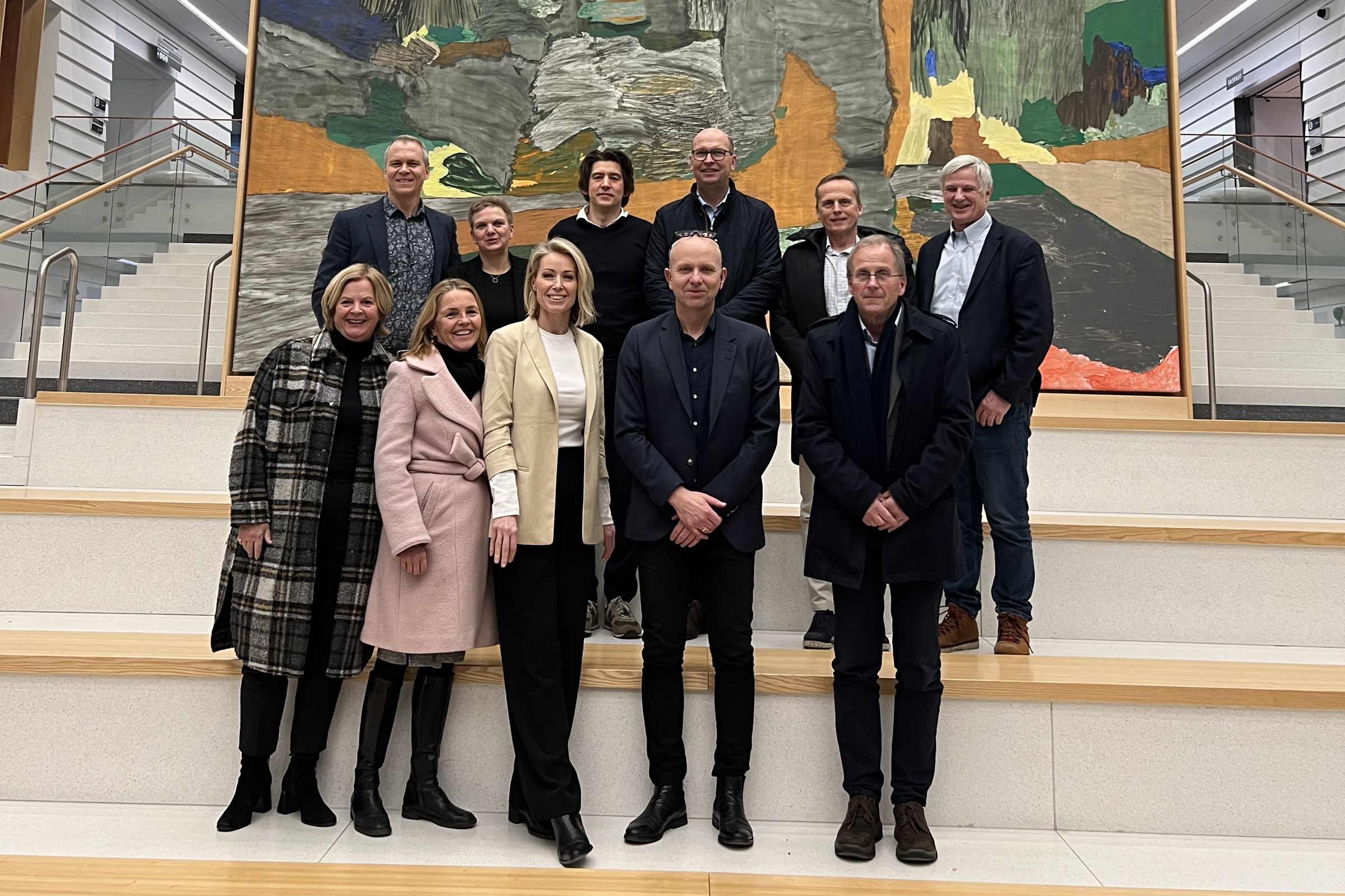 oslo university hospital management team on the stairs of main entrance at karolinska university hospital