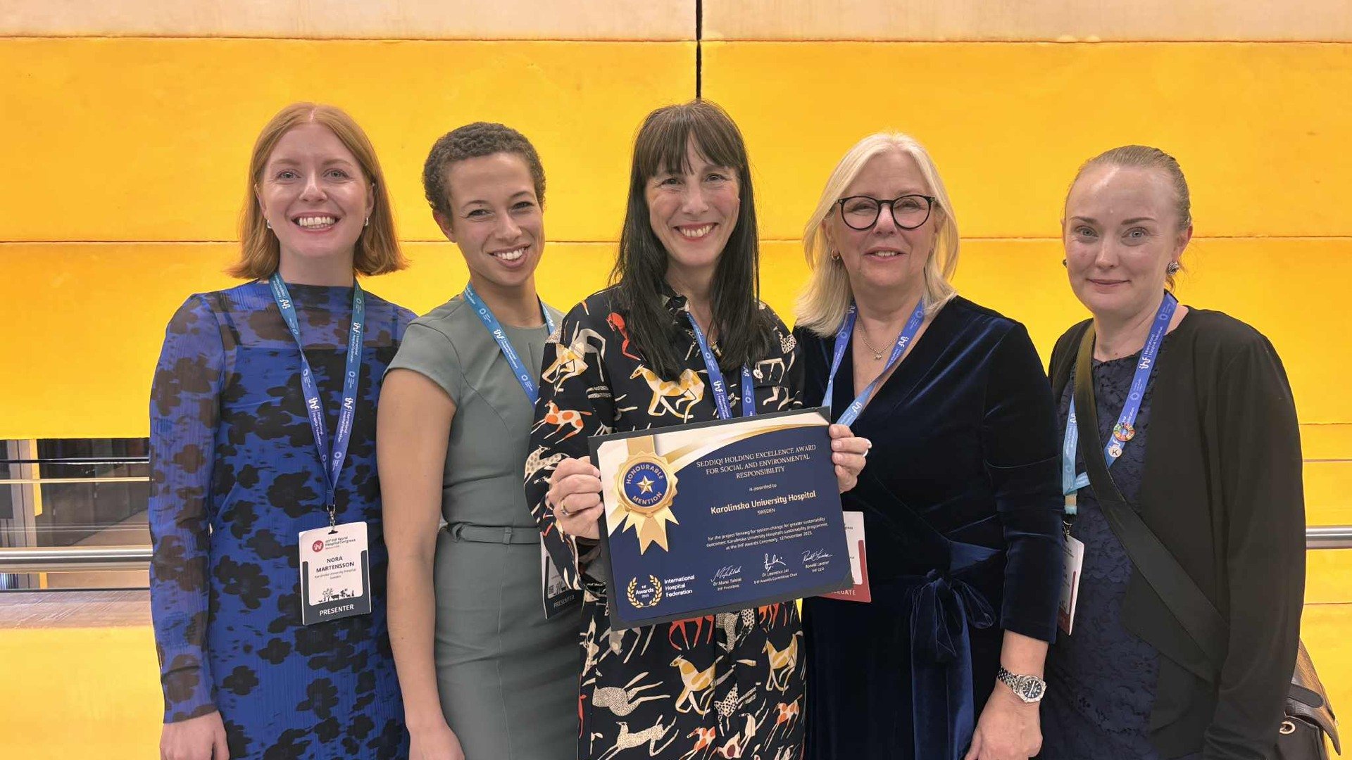 A group of women standing next to each other.
