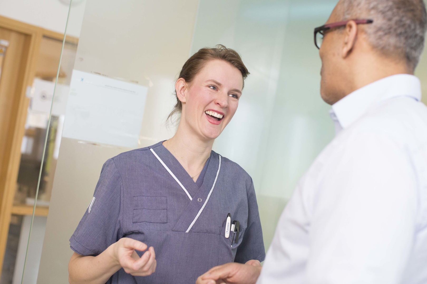 woman doctor talking with man 